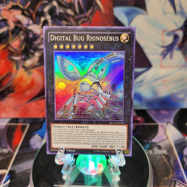 A Super Rare "Digital Bug Rhinosebus" card from the Yugioh Set: Shining Victories.