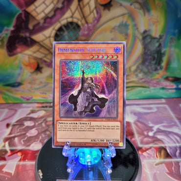 A Prismatic Secret Rare "Dimension Shifter" card from the Yugioh 2019 Gold Sarcophagus Mega-Tin.