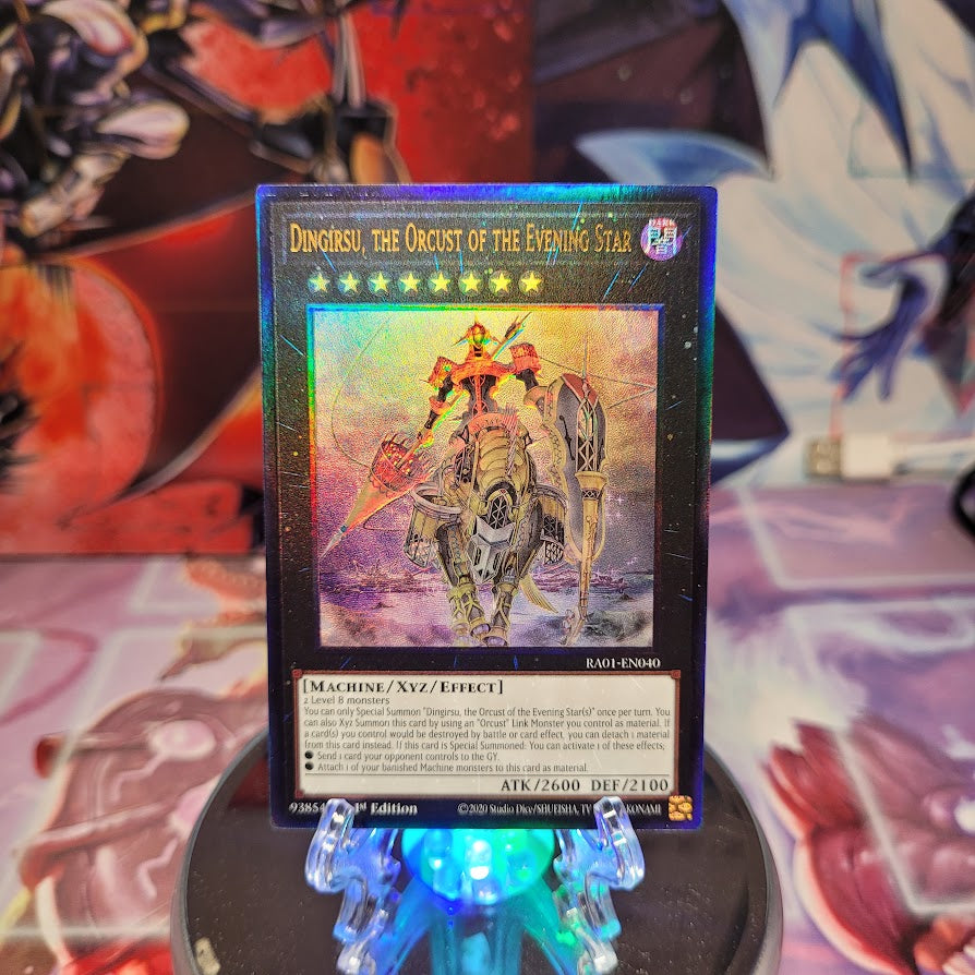 A Prismatic Ultimate Rare "Dingirsu, the Orcust of the Evening Star" card from the Yugioh Set: Rarity Collection 1 (RA01).
