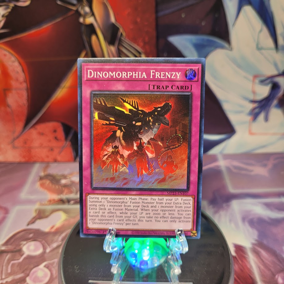 A Super Rare "Dinomorphia Frenzy" card from the Yugioh 25th Anniversary Tin: Dueling Heroes set.