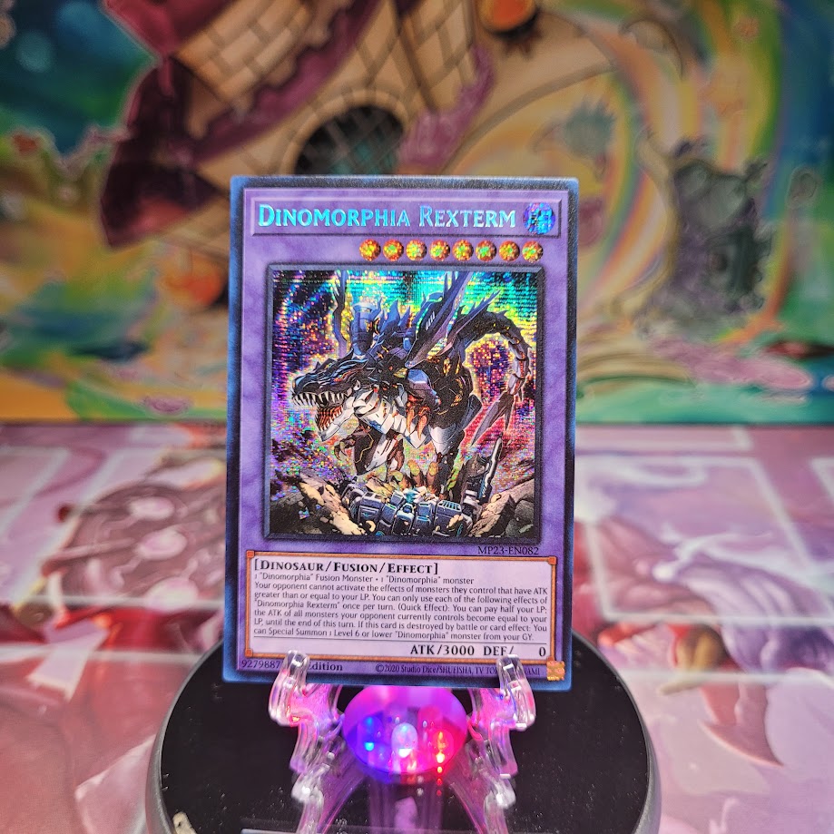 A Prismatic Secret Rare "Dinomorphia Rexterm" card from the Yugioh 25th Anniversary Tin: Dueling Heroes set.