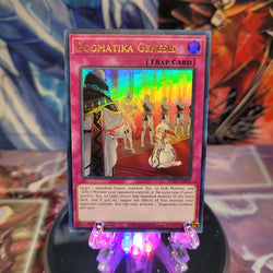 An Ultra Rare "Dogmatika Genesis" card from the Yugioh 2022 Tin of the Pharaoh's Gods Set (MP22).