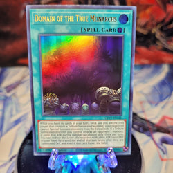 An Ultra Rare "Domain of the True Monarchs" card from the Yugioh Set: Ghosts From the Past: The 2nd Haunting (GFP2).