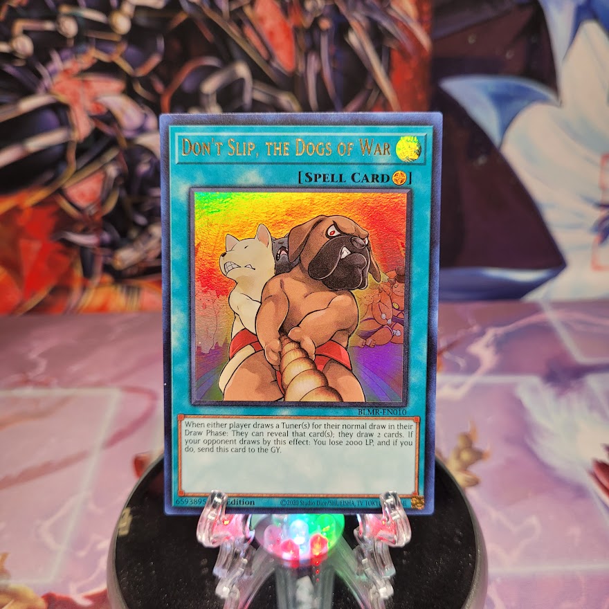 An Ultra Rare "Dont Slip, the Dogs of War" card from the Yugioh Set: Battles of Legend: Monstrous Revenge (BLMR).