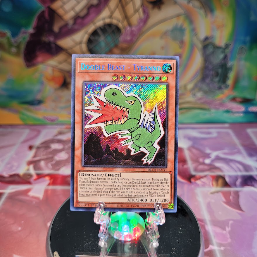 A Secret Rare "Doodle Beast - Tyranno" card from the Yugioh Set: Battles of Legend: Crystal Revenge.