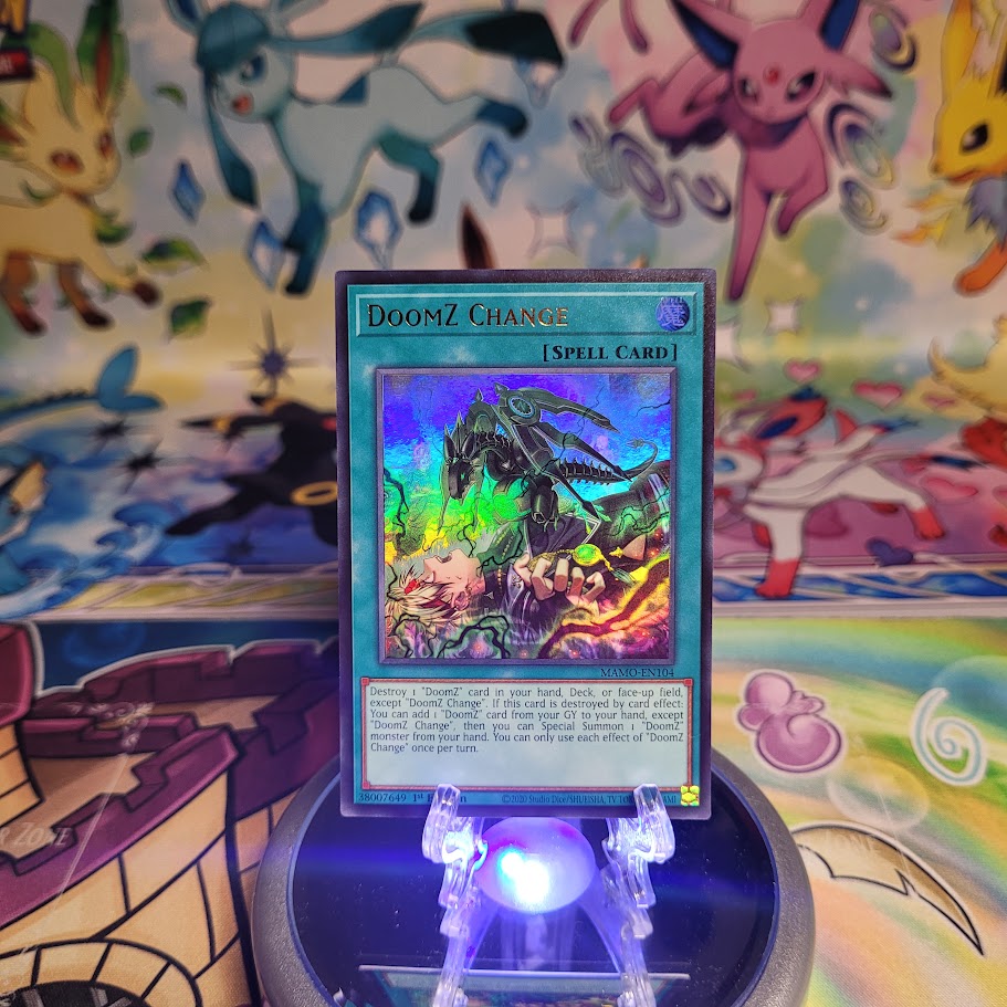 An Ultra Rare "DoomZ Change" card from the Yugioh Set: Magnificent Monsters (MAMO).