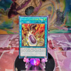  A Secret Rare "Double Evolution Pill" card from the Yugioh Set: Battles of Legend: Light's Revenge.