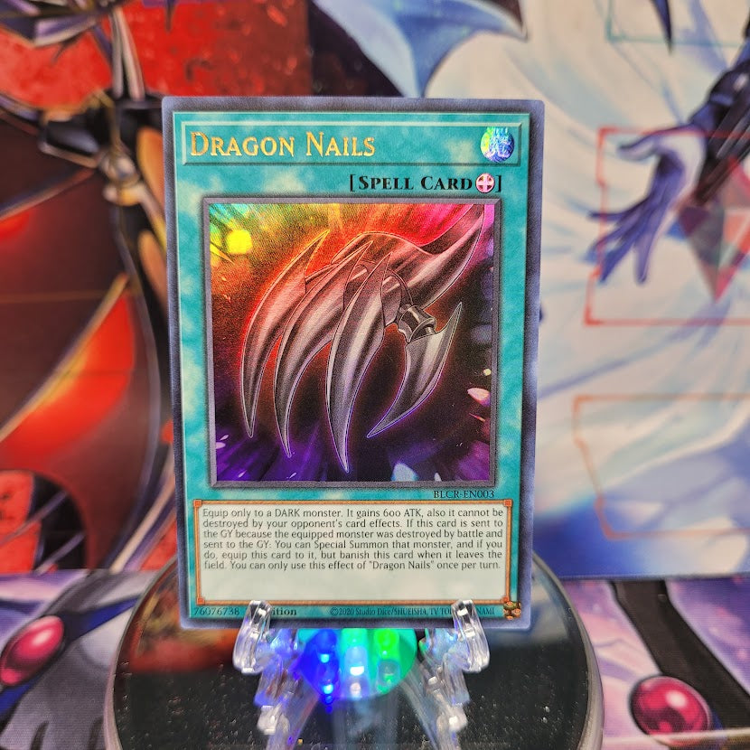 An Ultra Rare "Dragon Nails" card from the Yugioh Set: Battles of Legend: Crystal Revenge.