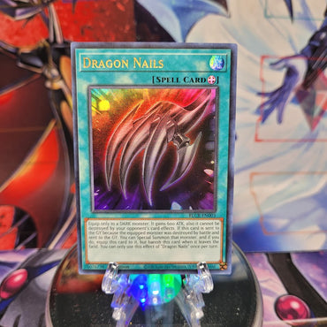 An Ultra Rare "Dragon Nails" card from the Yugioh Set: Battles of Legend: Crystal Revenge.