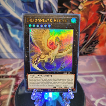 An Ultra Rare "Dragonlark Pairen" card from the Yugioh 2022 Tin of the Pharaoh's Gods Set.