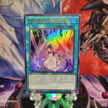 An Ultra Rare "Dragonmaid Changeover" card from the Yugioh Set: Magnificent Mavens.