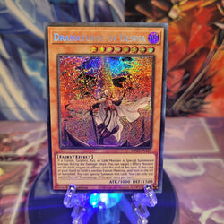 A Secret Rare "Dramaturge of Despia" card from the Yugioh 2022 Tin of the Pharaoh's Gods set.