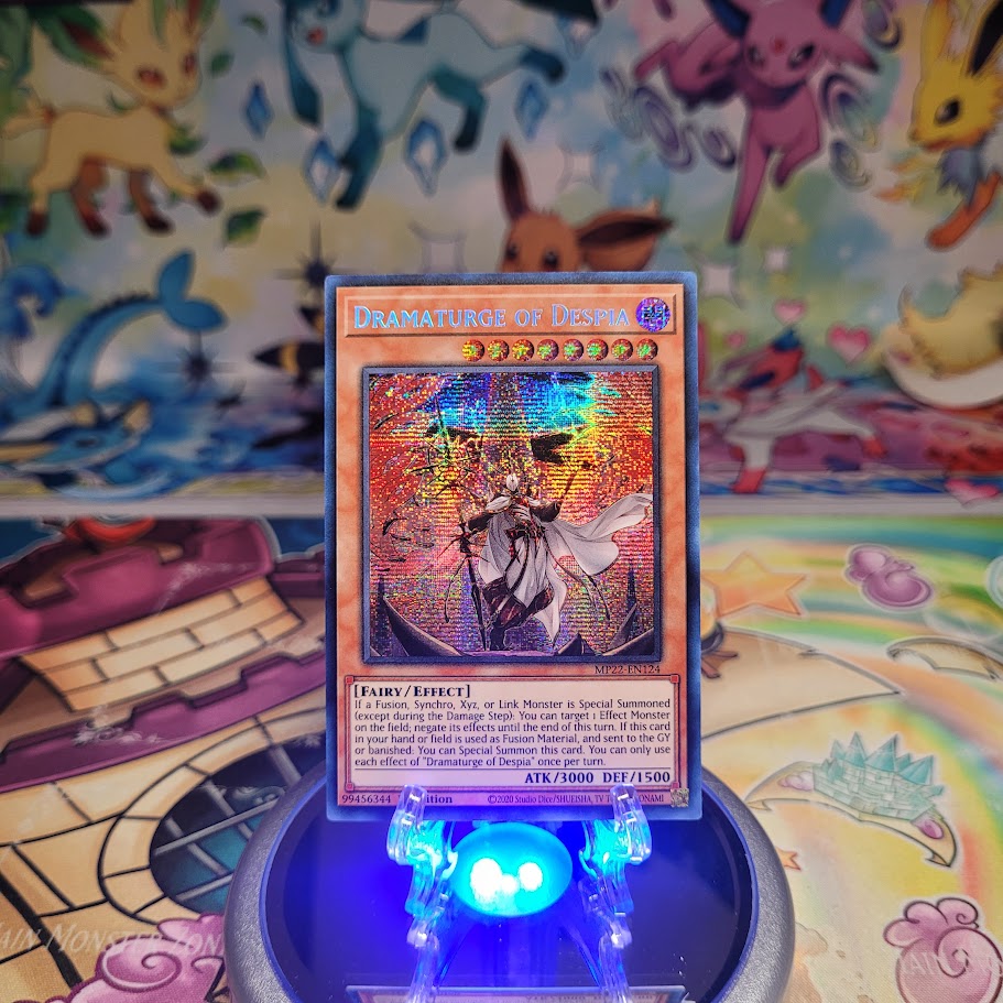 A Secret Rare "Dramaturge of Despia" card from the Yugioh 2022 Tin of the Pharaoh's Gods set (MP22).