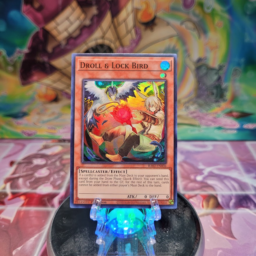 A Super Rare Alternate Art "Droll & Lock Bird" card from the Yugioh Set: Rarity Collection 2 (RA02).