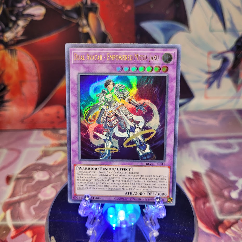 An Ultra Rare "Dual Avatar - Empowered Mitsu-Jaku" card from the Yugioh Set: Blazing Vortex.