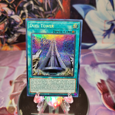 A Prismatic Secret Rare "Duel Tower" card from the Yugioh 2022 Tin of the Pharaoh's Gods Set.