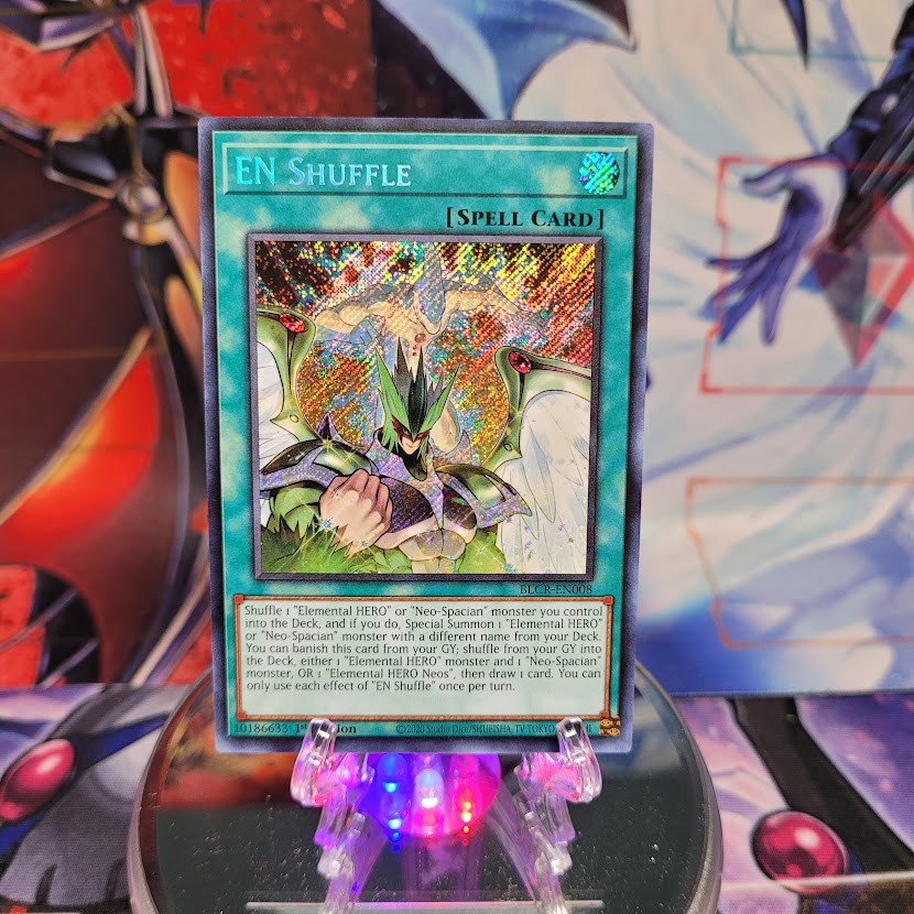  A Secret Rare "EN Shuffle" card from the Yugioh Set: Battles of Legend: Crystal Revenge (BLCR).