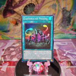 A Super Rare "Earthbound Prison" card from the Yugioh Set: Maze of Millennia.