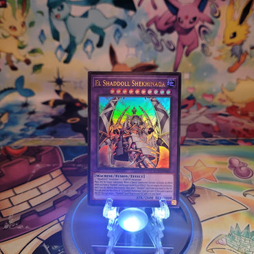 An Ultra Rare "El Shaddoll Shekhinaga" card from the Yugioh Set: Battles of Legend: Glorious Gallery (BLGG).