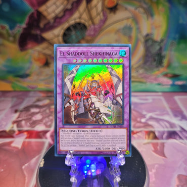 A Super Rare "El Shaddoll Shekhinaga" card from the Yugioh Structure Deck: Shaddoll Showdown.