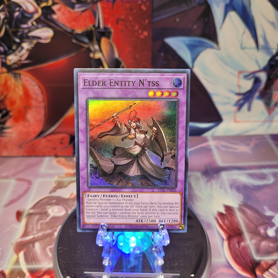 A Super Rare "Elder Entity N'Tss" card from the Yugioh Set: Rarity Collection 1 (RA01).