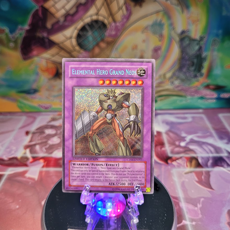 A Secret Rare "Elemental Hero Grand Neos" card from the Yugioh 2007 Collector Tins.