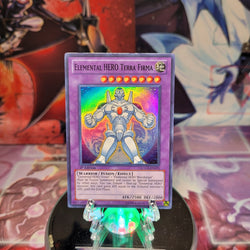 A Super Rare "Elemental Hero Terra Firma" card from the Yugioh Set: Legendary Collection 2 (LCGX).