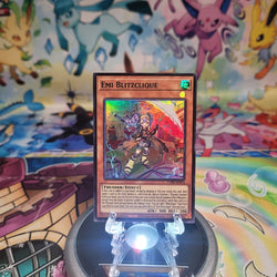 A Super Rare “Emi Blitzclique” card from the Yugioh Set: Chaos Origins (CORI).
