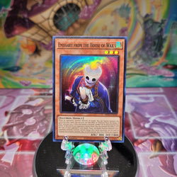 A Super Rare "Emissary From the House of Wax" card from the Yugioh Set: Phantom Nightmare.