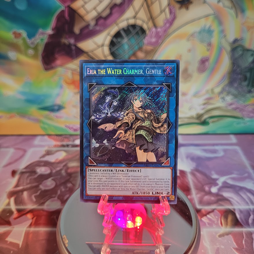  A Secret Rare "Eria the Water Charmer, Gentle" card from the Yugioh Set: Quarter Century Bonanza (RA03).