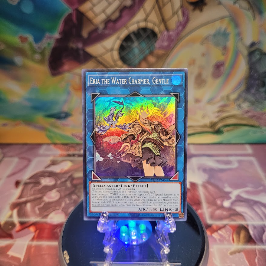 A Super Rare "Eria the Water Charmer, Gentle" card from the Yugioh Set: Quarter Century Bonanza (RA03).