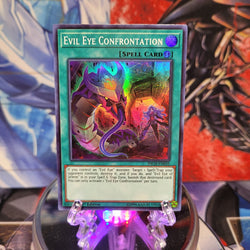  A Super Rare "Evil Eye Confrontation" card from the Yugioh Set: The Infinity Chasers.