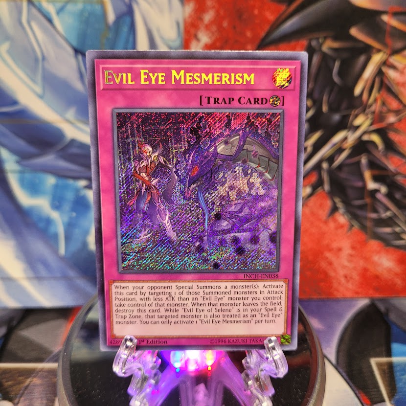  A Secret Rare "Evil Eye Mesmerism" card from the Yugioh Set: The Infinity Chasers.