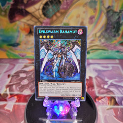 A Secret Rare "Evilswarm Bahamut" card from the Yugioh Set: Hidden Arsenal 7: Knight of Stars (HA07).