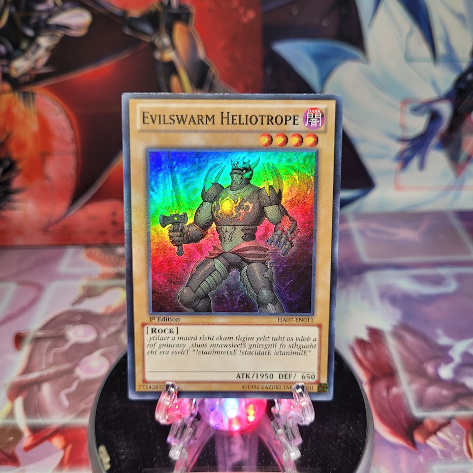 A Super Rare "Evilswarm Heliotrope" card from the Yugioh Set: Hidden Arsenal 7: Knight of Stars (HA07).