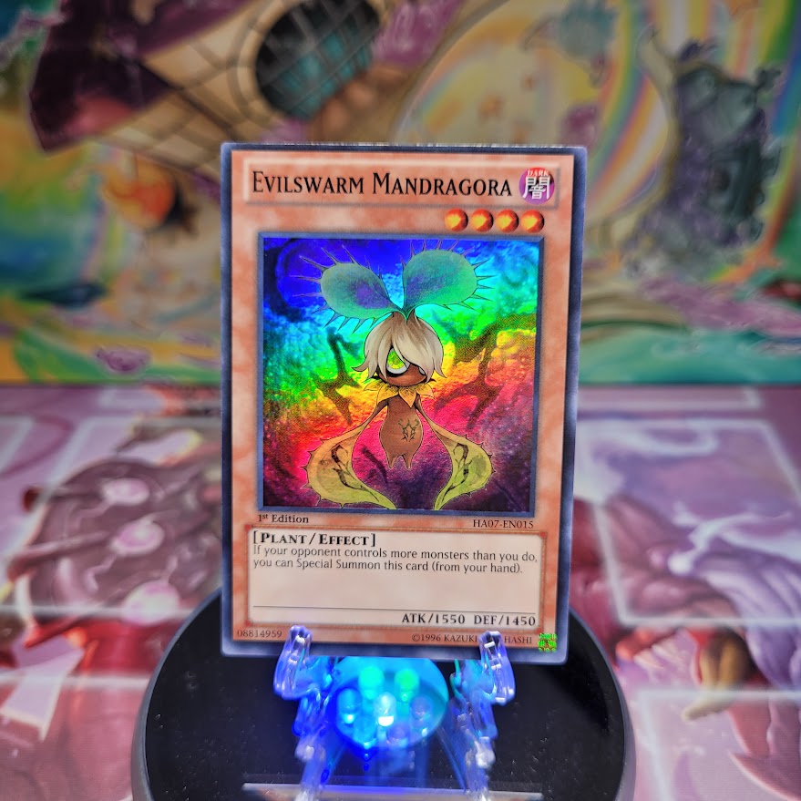 A Super Rare "Evilswarm Mandragora" card from the Yugioh Set: Hidden Arsenal 7: Knight of Stars (HA07).
