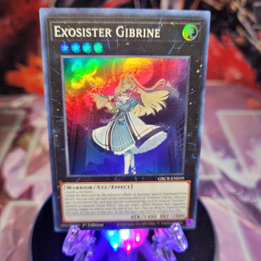  A Super Rare "Exosister Gibrine" card from the Yugioh Set: The Grand Creators.