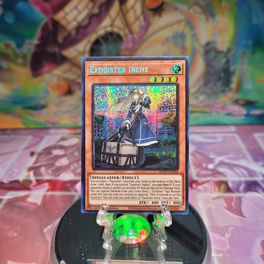 A Prismatic Secret Rare "Exosister Irene" card from the Yugioh Set: 25th Anniversary Tin: Dueling Heroes Mega-Tin Mega Pack. 