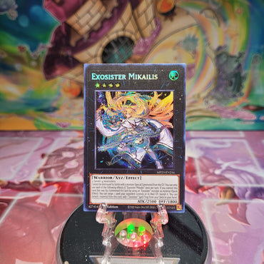 A Prismatic Secret Rare "Exosister Mikailis" card from the Yugioh Dueling Heroes Mega-Tin Mega Pack.