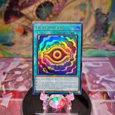 An Ultra Rare "Eye of Illusion" card from the Yugioh Set: Maze of Millennia (MZMI).