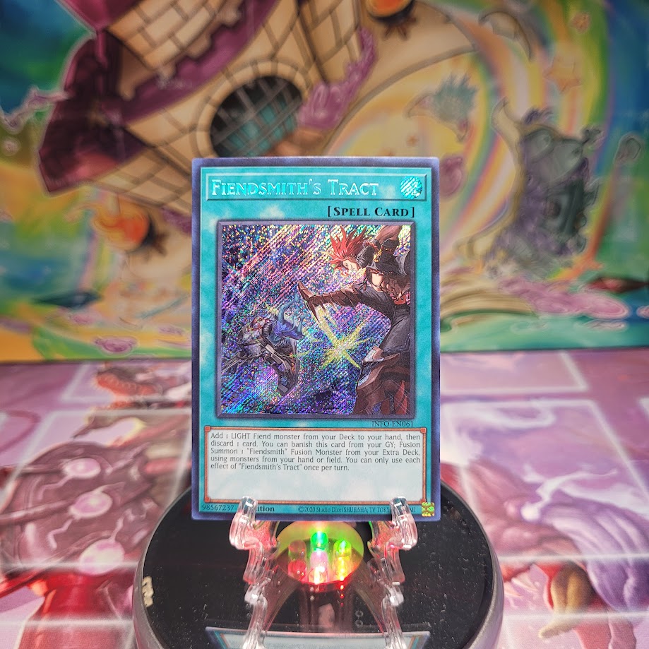 A Secret Rare "Fiendsmith's Tract" card from the Yugioh Set: The Infinite Forbidden (INFO).