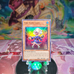 An Ultra Rare "Fire Flint Lady" card from the Yugioh Set: Battles of Legend: Armageddon.