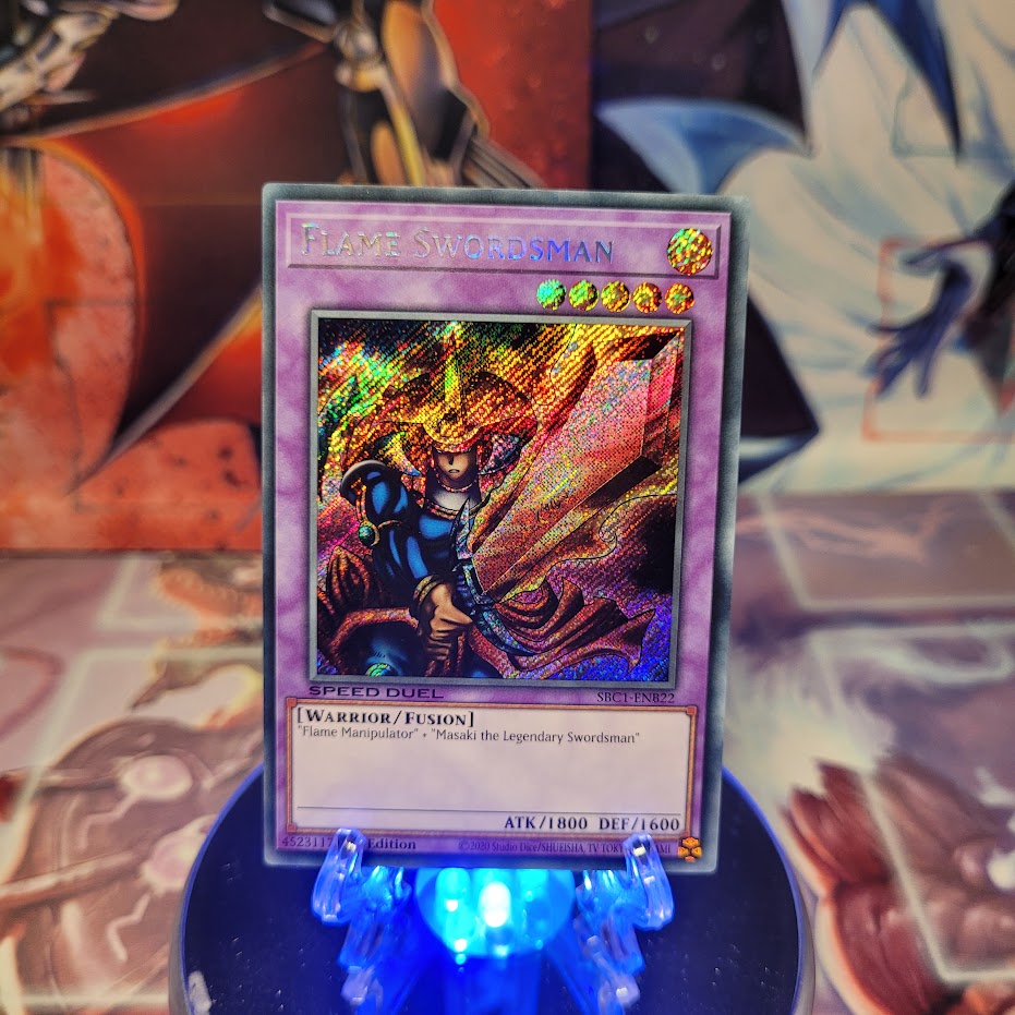 A Secret Rare "Flame Swordsman" card from the Yugioh Set: Speed Duel: Streets of Battle City.