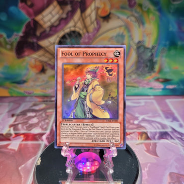 A Super Rare "Fool of Prophecy" card from the Yugioh Set: Cosmo Blazer.