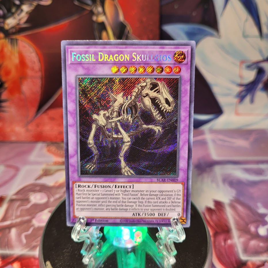 A Secret Rare "Fossil Dragon Skullgios" card from the Yugioh Set: Battles of Legend: Armageddon (BLAR)..