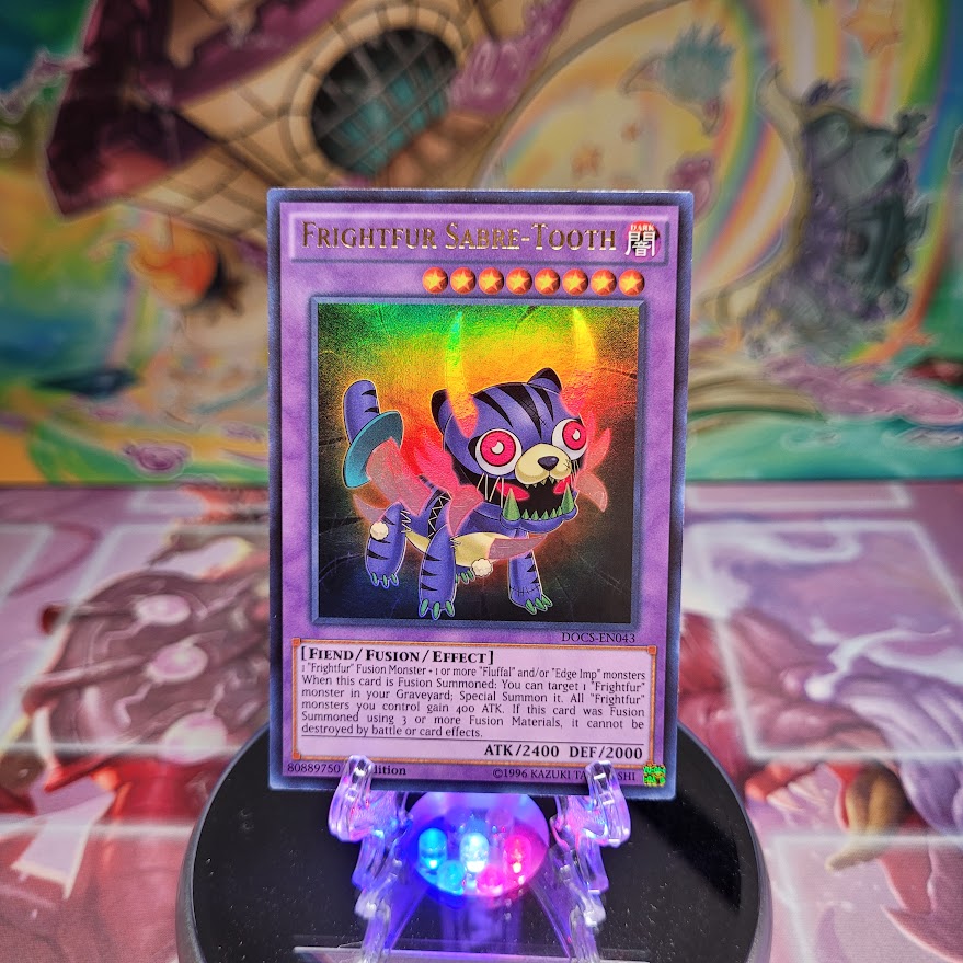 An Ultra Rare "Frightfur Sabre-Tooth" card from the Yugioh Set: Dimensions of Chaos (DOCS).
