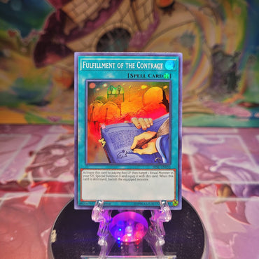 A Super Rare "Fulfillment of the Contract" card from the Yugioh Set: Hidden Summoners.