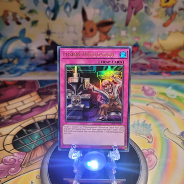 An Ultra Rare "Fusion Duplication" card from the Yugioh Structure Deck: The Fallen & The Virtuous (CH01).