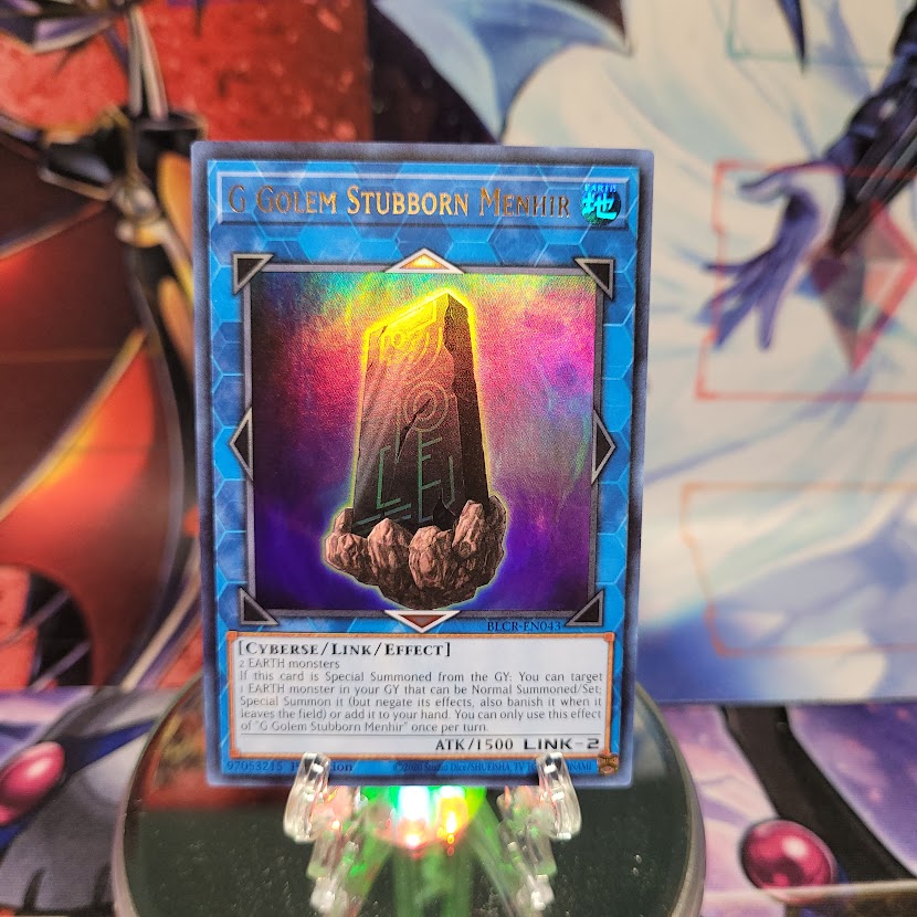 An Ultra Rare "G Golem Stubborn Menhir" card from the Yugioh Set: Battles of Legend: Crystal Revenge.