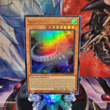 An Ultra Rare "Galaxy-Eyes Afterglow Dragon" card from the Yugioh Set: Magnificent Mavens.